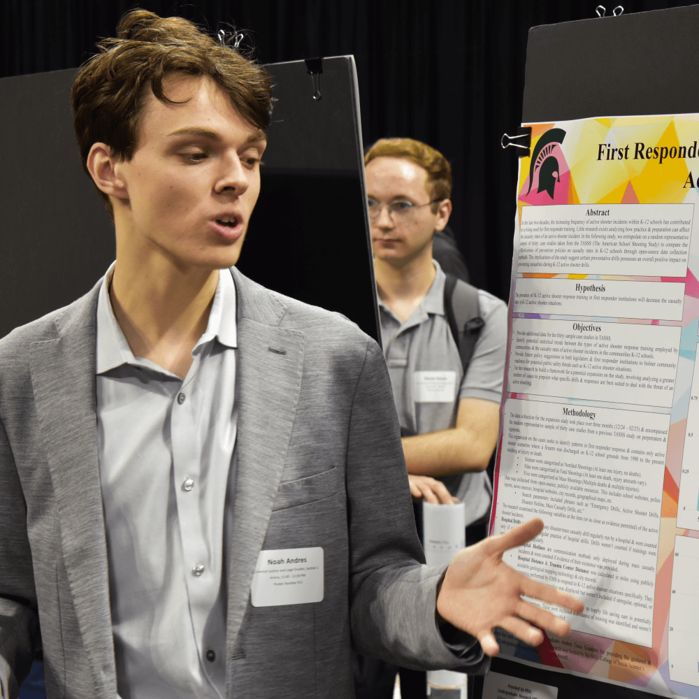 Photo of Noah Andres presenting at UURAF